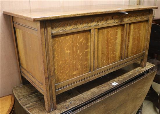 A 20th century oak coffer, W.107cm